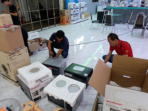 Repairing microwaves damaged in the September flood Phot